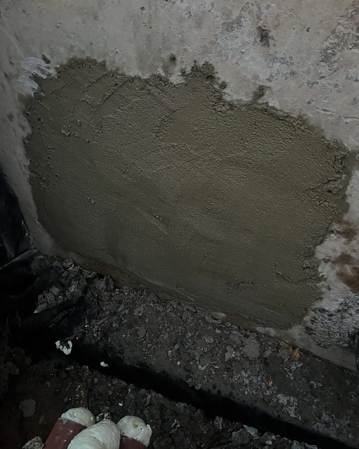 Reparation av husgrund inför dränering i Stockholm